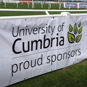 A sign saying University of Cumbria, Proud Sponsors 