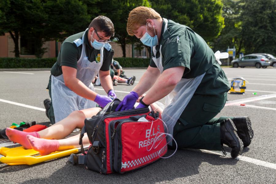 Paramedic students aid an injured person