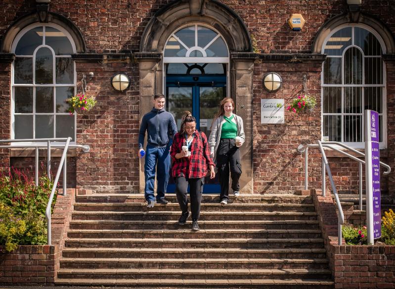 Student walking down some steps.