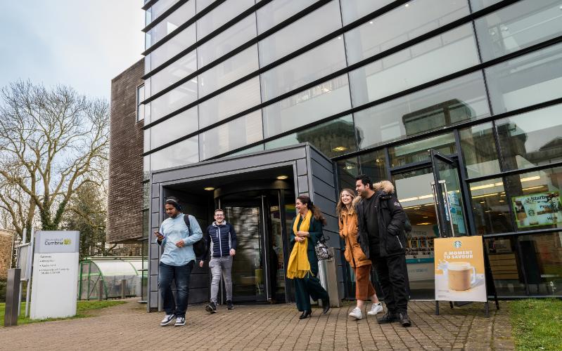 Students walking out of building.