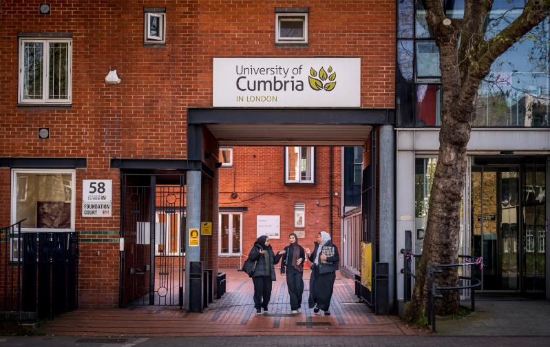 A group of students walking out of campus