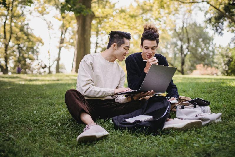 Students sitting on grass